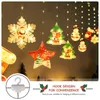 Christmas-themed decorative lights in various shapes like snowflakes, trees, and snowmen, hanging against a dark background. Produktbild-Vorschau