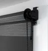Close-up of a roller blind mechanism attached to a window frame. Produktbild-Vorschau