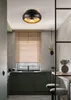 A modern kitchen with dark green cabinets, a window with blinds, and a ceiling light fixture. Náhľad obrázku produktu