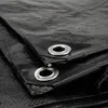 Close-up of a black tarp with grommets. Produktbild-Vorschau