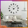 A living room scene with a large wall clock, sofa, and coffee table. Náhled obrázku produktu