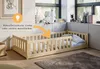 A child's bed with a safety rail in a room. Produktbild-Vorschau