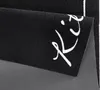A close-up view of a black kitchen runner with white cursive text on it. Anteprima dell’immagine prodotto