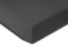 A close-up, angled view of a dark gray piece of foam material, likely a mattress topper or similar bedding product, against a white background. Produktbild-Vorschau