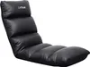 A black gaming floor chair with a white logo on the headrest, isolated on a white background. Náhľad obrázku produktu
