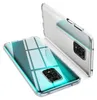 Two transparent phone cases are shown against a white background. One case is lying flat, showing the back of a phone with a camera module. The other case is standing upright, showing its side and back. Anteprima dell’immagine prodotto