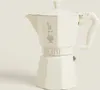 A cream-colored Bialetti Moka coffee maker is shown against a light gray background. Anteprima dell’immagine prodotto