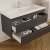 A modern bathroom vanity with a sink and drawers, showcasing storage solutions. Produktbild-Vorschau