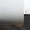 A close-up view of a shower enclosure corner with a city skyline visible in the background. Produktbild-Vorschau