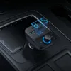 A car's center console with a black FM transmitter plugged into the power outlet. Anteprima dell’immagine prodotto