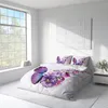 A bedroom scene with a bed featuring butterfly and floral patterned bedding, a large window, and a nightstand. Produktbild-Vorschau
