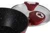 A close-up view of a red and black cooking pot with a glass lid. Podgląd zdjęcia produktu