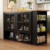A kitchen island with a sideboard and cabinet, featuring various kitchen items and decor. Produktbild-Vorschau