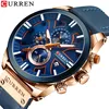 A close-up shot of a men's wristwatch with a blue dial and rose gold casing. Produktbild-Vorschau