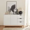 A white sideboard with wooden legs and a wooden top, decorated with various objects and artwork. Anteprima dell’immagine prodotto