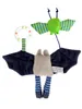 A hanging toy for a baby's car seat, featuring two bat-like figures and a ring. Produktbild-Vorschau