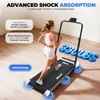 A woman is running on a treadmill in a room. Anteprima dell’immagine prodotto