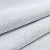 A close-up view of folded light gray fabric with a visible texture. Produktbild-Vorschau