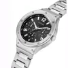 A close-up, angled shot of a silver Guess watch with a black face and metal band, presented against a white background. Produktbild-Vorschau