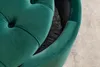 A close-up view of a green velvet stool with a black interior. Produktbild-Vorschau