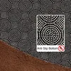 A close-up view of the bottom of a rug, showing the anti-slip pattern and the brown fabric. Produktbild-Vorschau