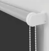 A close-up view of a white roller blind mechanism and pull cord attached to a wall. Produktbild-Vorschau