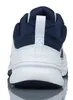 The back view of a white and navy Nike shoe. Voir les images du produit