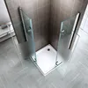 A modern shower cabin with glass doors and a white shower tray, set in a bathroom with tiled walls and a patterned floor. Produktbild-Vorschau