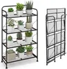 A black metal plant stand with multiple shelves, holding various potted plants. A folded version of the plant stand is shown to the right. Produktbild-Vorschau