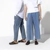 Two people wearing casual clothing and Birkenstock clogs. Produktbild-Vorschau