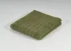 A folded green towel on a white background. Produktbild-Vorschau
