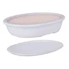 A white oval ceramic bonsai pot with a pink interior and a matching saucer are shown against a white background. Produktbild-Vorschau