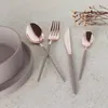 A set of cutlery and bowls on a textured surface, with some dried flowers in the background. Náhľad obrázku produktu