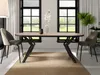 A dining room setting with an oval table and chairs, set against a backdrop of windows and curtains. Voir les images du produit