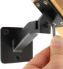 A hand is using an Allen wrench to tighten a screw on a black metal handrail bracket attached to a wooden surface. Náhľad obrázku produktu