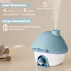 A mushroom-shaped humidifier with mist coming out, placed on a table with some flowers in the background. Produktbild-Vorschau