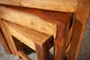 A close-up shot of nesting tables made of wood. Produktbild-Vorschau