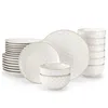 A collection of white ceramic dinnerware with a subtle embossed pattern. Náhled obrázku produktu