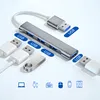 A silver USB hub with multiple ports and connected USB devices, presented on a light background with icons below. Produktbild-Vorschau