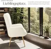 A fluffy white armchair in a well-lit room with a large window overlooking trees. Náhled obrázku produktu