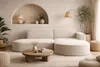 A modern living room with a sectional sofa, coffee table, and floor lamp. Produktbild-Vorschau