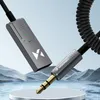 A close-up shot of a Wozinsky Bluetooth audio adapter with a 3.5mm jack, set against a stylized background of water and mountains. Anteprima dell’immagine prodotto