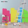 A room being painted with colorful splotches on the wall, a ladder, and painting supplies. Produktbild-Vorschau