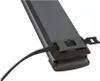 A close-up shot of a black power strip with a velcro strap attached. Podgląd zdjęcia produktu
