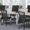 An office setting with multiple mesh office chairs and desks visible. Produktbild-Vorschau