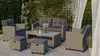 An outdoor patio setting with a polyrattan lounge furniture set. Náhled obrázku produktu