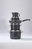 A stack of dark grey pots and pans is displayed against a white background. Anteprima dell’immagine prodotto