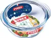 A clear glass baking dish with a lid, featuring product labels and branding. Produktbild-Vorschau