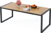 A rectangular outdoor dining table with a slatted wooden top and a dark metal frame, set against a white background. Decorative items like a vase of flowers, a bowl of fruit, and a magazine are placed on the table. Podgląd zdjęcia produktu