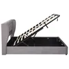 A side view of a gray upholstered bed frame with the mattress support mechanism lifted, revealing the storage space underneath. Náhled obrázku produktu